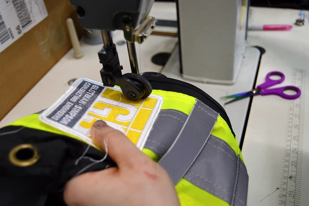 Custom patch being sewn